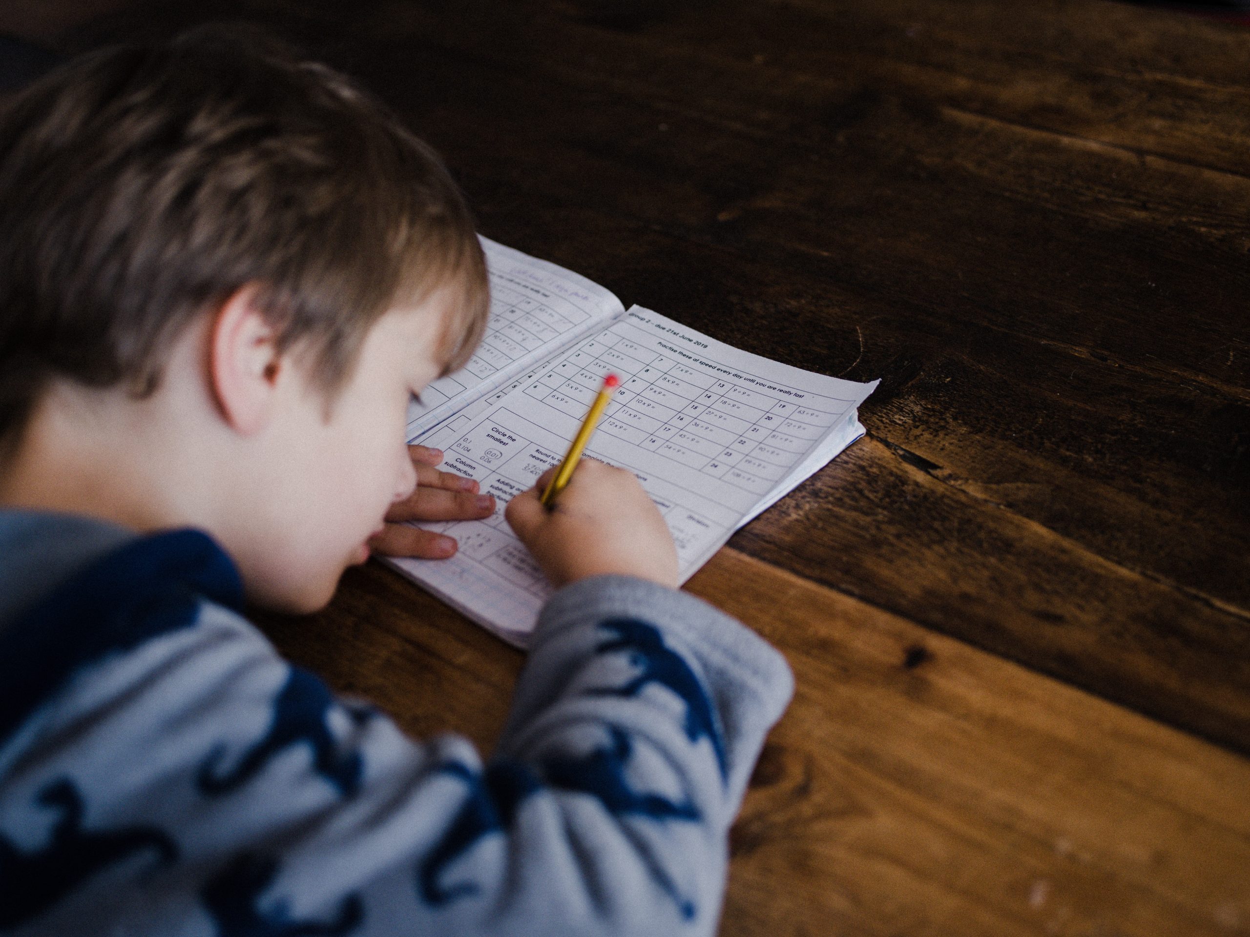 boy is solving math problems